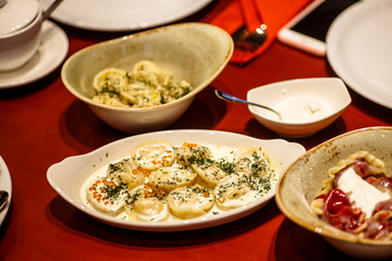 Russian traditional dumplings with fish and salmon ROE.