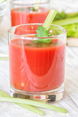 Two glasses of tomato juice.