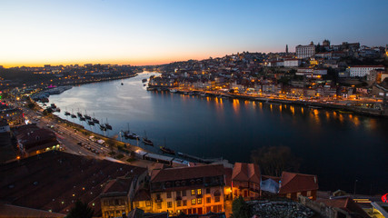 View of Douro river and Ribeira at night time, Porto, Portugal..