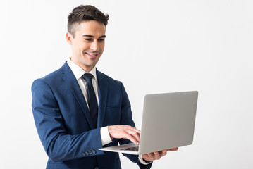 Outgoing male working with notebook computer