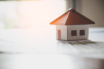 House from the paper on wooden background