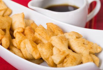 Closeup of delicious ecuadorian pristinos, piled up fresh from the fryer, traditional andean pastry suitable for coffee meetings
