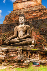 Big Buddha statue at Wat Mahathat (temple). Sukhothai Historical Park, Thailand. Unesco World Heritage Site