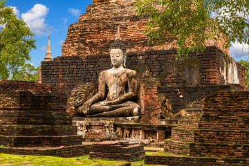 Big Buddha statue at Wat Mahathat (temple). Sukhothai Historical Park, Thailand. Unesco World Heritage Site