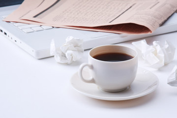 Working with crumpled paper and coffee cup on table background