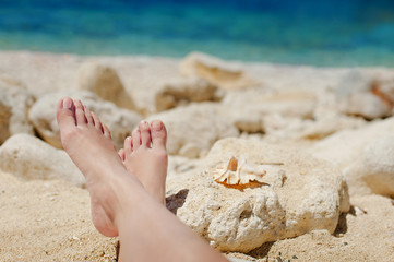 Bare feet in the sea on the shore of the Sea