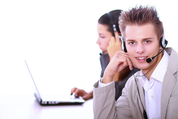 Friendly customer service consultants working, focus on a young man