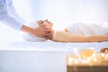 Naklejka premium Young woman lying on a massage table,relaxing with eyes closed