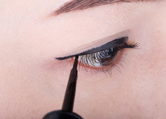 woman make-up with black eyeliner