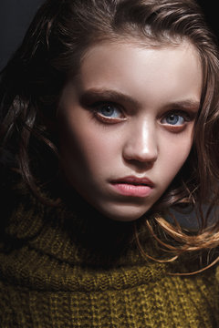model girl tests portrait over dark background