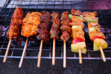 Barbecue grill with various kinds of meat, close-up, selective focus.