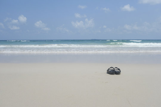 Black sandal on the beach.