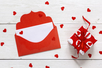 Red envelope and gift box on white background.