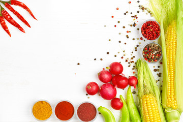 Detox food & drink healthy diet lifestyle concept: Tasty green & orange sweet fruits & vagatables. Sweet corn apple olive oil pepper radish Top view White wooden background  Free space text layout