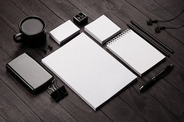 Corporate identity template,  blank stationery set with coffee and earphone on black stylish wood...