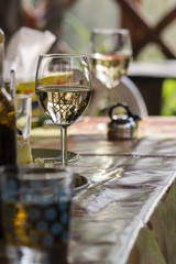 A glass of white wine on the table during a celebration.