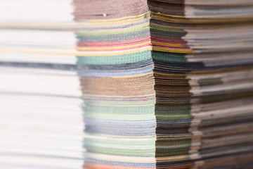 stack of colorful magazines or documents - paper
