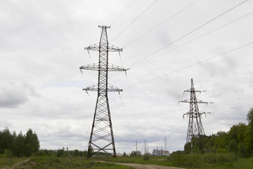 Elenergy pylons and lines near big city