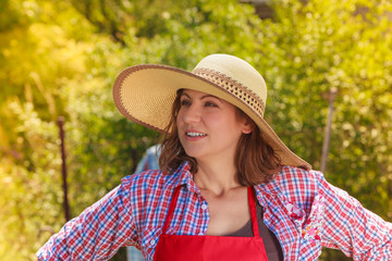 Portrait woman with hat in garden