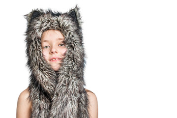 Little girl in a fur hat with cat's ears on a white background. Isolated