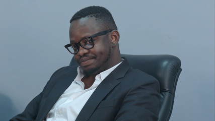 Thoughtful african american businessman sitting in office