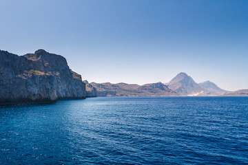 The calm sea with a mountain coast in the northwest of Crete, Greece