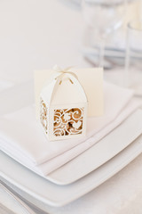 Sweet presents to guests. A small nice present. Bonbonniere. Beautiful cute little boxes with decorative cut for candies