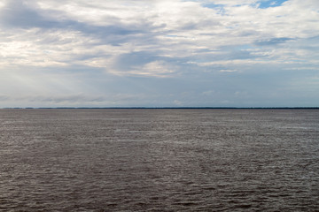 Cloudy sky and Amazon river, Brazil