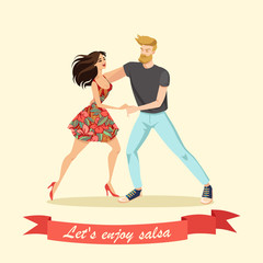 Beautiful young couple dancing salsa.