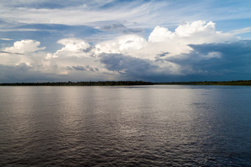 Cloudy sky and Amazon river, Brazil