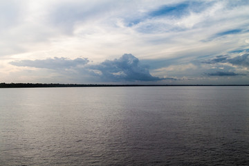 Cloudy sky and Amazon river, Brazil