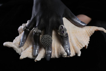 Obraz premium Silver jewelry on a dark background