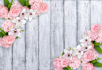 Magnolia flowers with roses, hortensia and place for your text