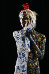 Fototapeta premium Body art of a girl in the style of Khokhloma and Gzhel