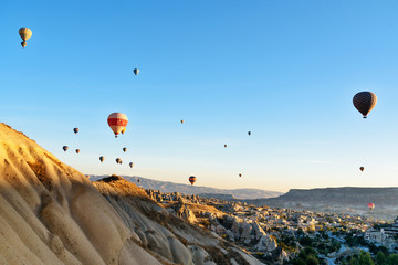 Hot air balloons flying over valley in the morning. Cappadocia. Turkey