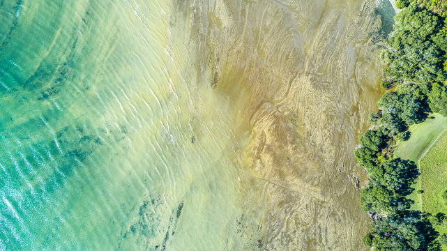 Aerial View On Sunny Beach At A Low Tide. Auckland, New Zealand