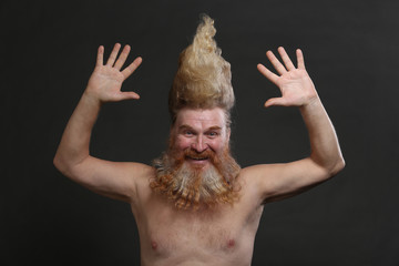 adult man with a beard and high mohawk