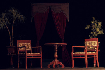 Old wooden round table and two chairs