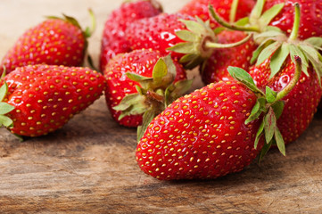 Strawberry on an old wooden background