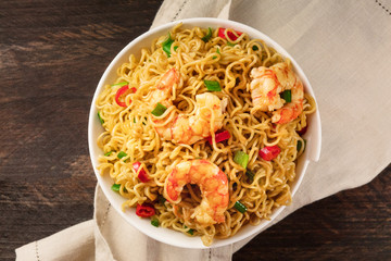 Instant noodles with vegetables, shrimps, and copy space
