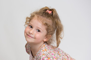 Studio Portrait of a sweet Little girl kidding around