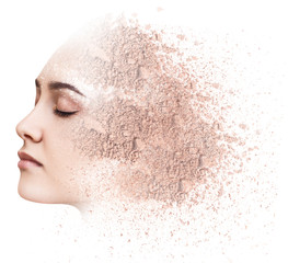 Woman face made from crumbly powder.