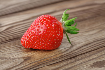 top view of  strawberry lying on  wooden background