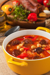 Traditional chickpea soup with paprika and chorizo sausage.