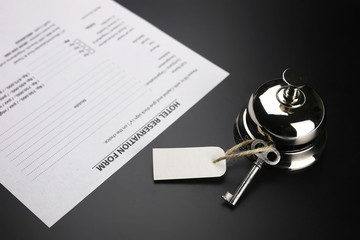 bell and the key at the reception in the hotel