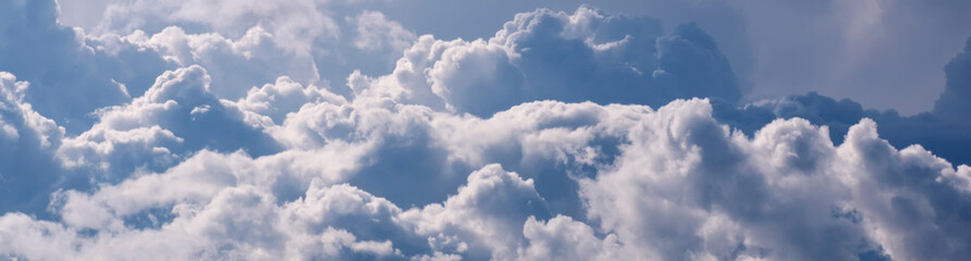 Fototapeta premium Sky with big white clouds panorama