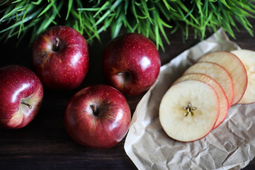 Red fresh apple on a wooden table