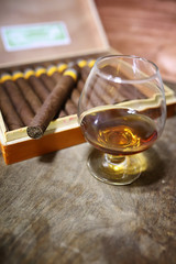 Large box of Cuban cigars on a wooden table