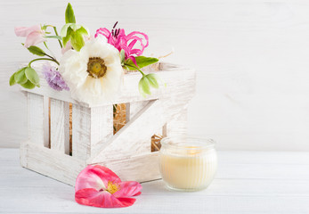 Obraz na płótnie Canvas Wooden box with poppy and flowers