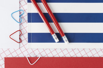 Red and blue accents of school supplies